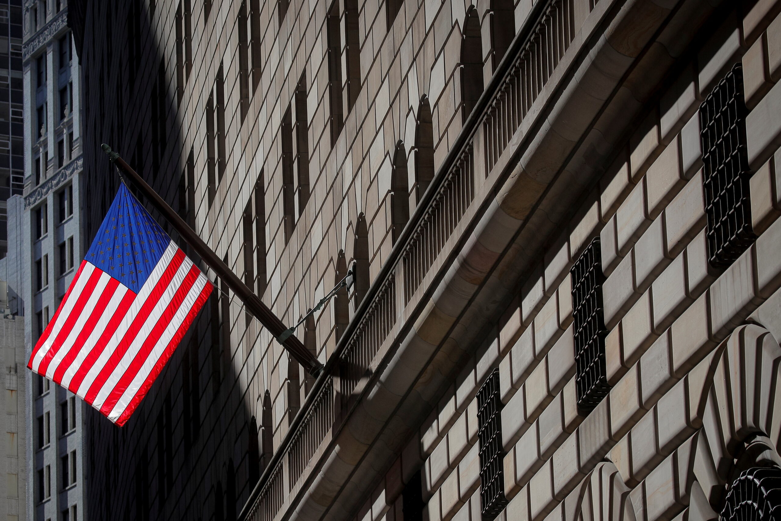 FILE PHOTO: A U.S. flag flies outside The Federal Reserve Bank of New York in New York