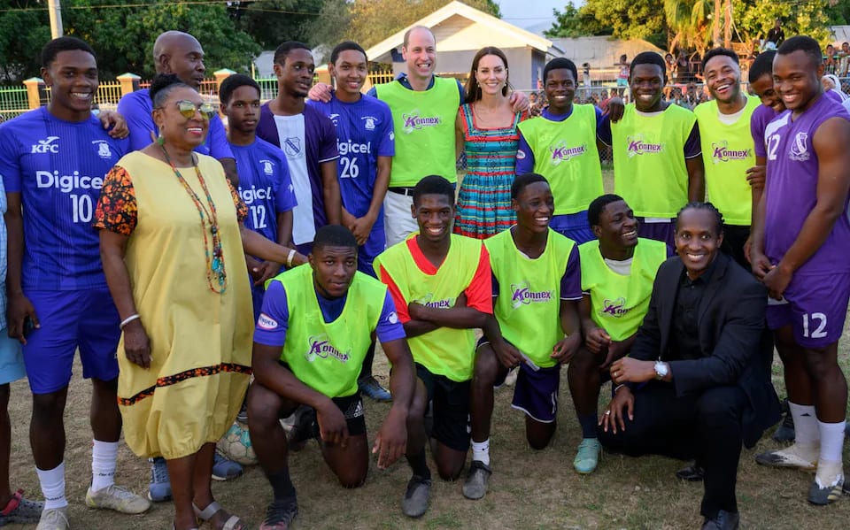 The Princess alongside the Prince of Wales and Sterling (third from right) with a group of footballers in Jamaica Credit WireImage