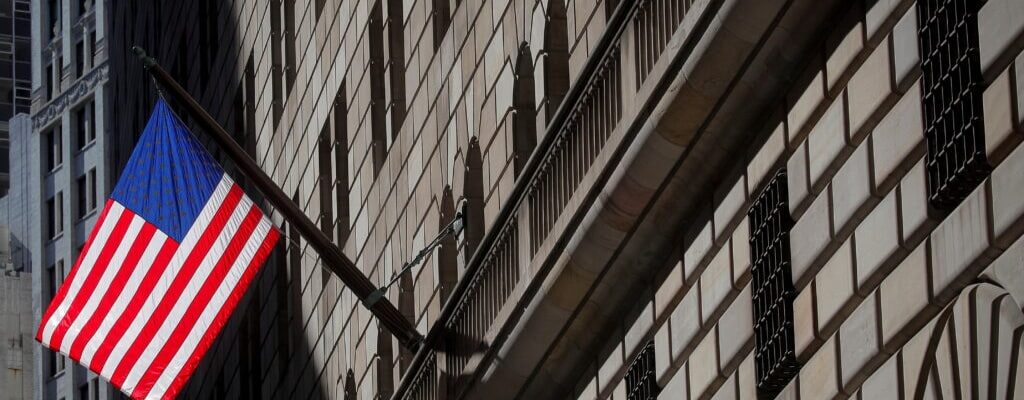 FILE PHOTO: A U.S. flag flies outside The Federal Reserve Bank of New York in New York