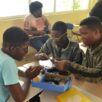 UTech, Ja STEM Summer Camp students working on robot 2