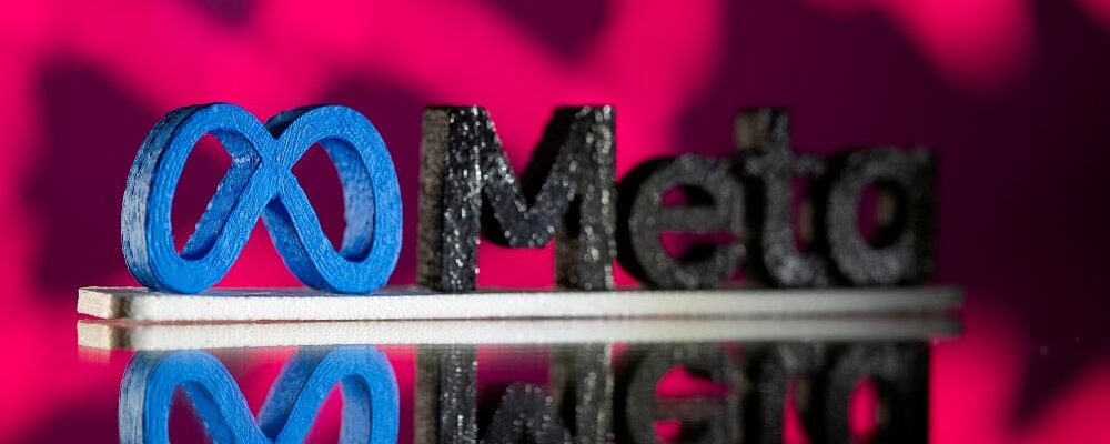 FILE PHOTO: A 3D printed Facebook’s new rebrand logo Meta is seen in front of displayed stock graph in this illustration