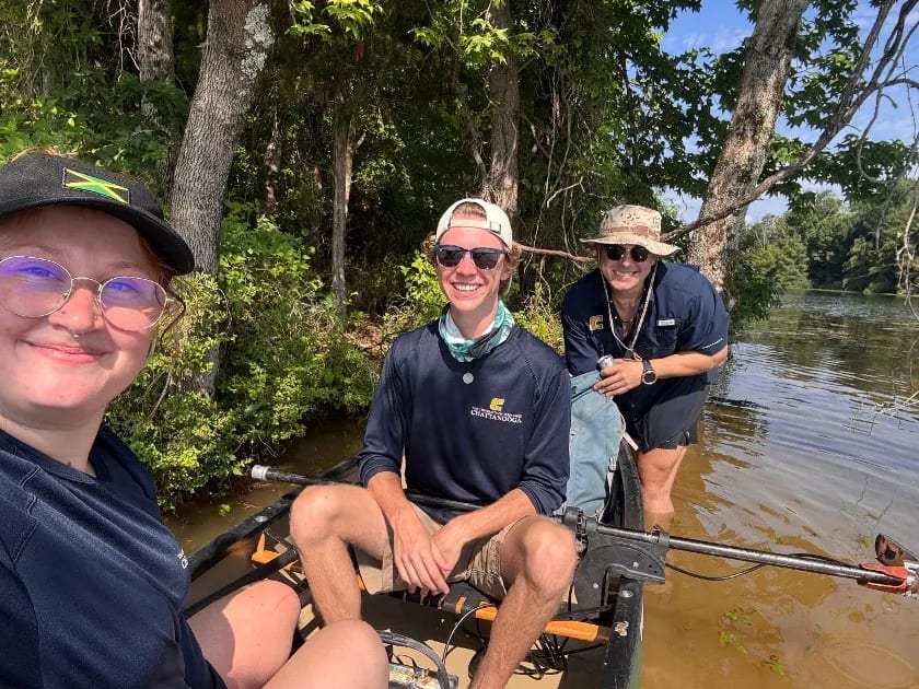 Faith Johnson (left), Tom Laufenberg and AJ Van Slyke surveying the sunken town of Old Harrison from a canoe rigged with survey gear on Chickamauga Lake in Chattanooga. Photo courtesy of AJ Van Slyke.
