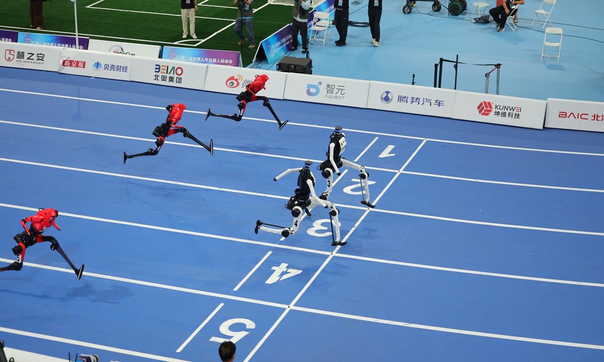 The large group 100-meter sprint match on the 2nd World Humanoid Robot Games on August 26, 2026. Photo_ Li Hao_GT