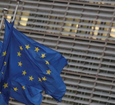 EU flags flutter outside the European Commission headquarters in Brussels