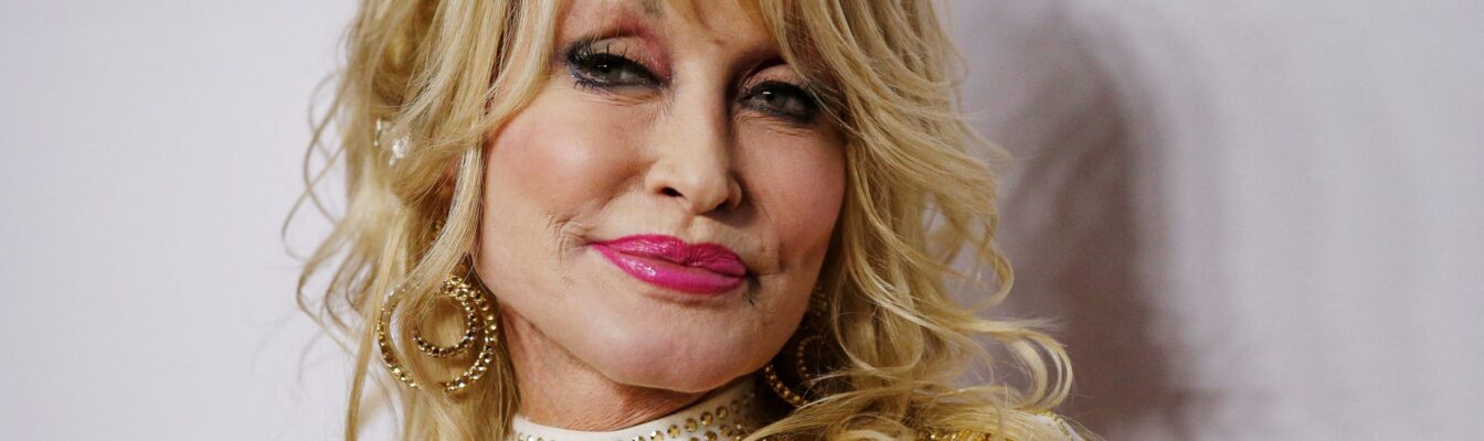 FILE PHOTO: Dolly Parton attends a red carpet gala event honoring her as the MusiCares person of the year in Los Angeles