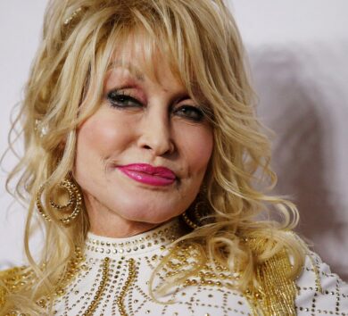 FILE PHOTO: Dolly Parton attends a red carpet gala event honoring her as the MusiCares person of the year in Los Angeles
