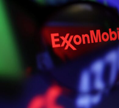 Illustration shows Exxon Mobil logo and stock graph