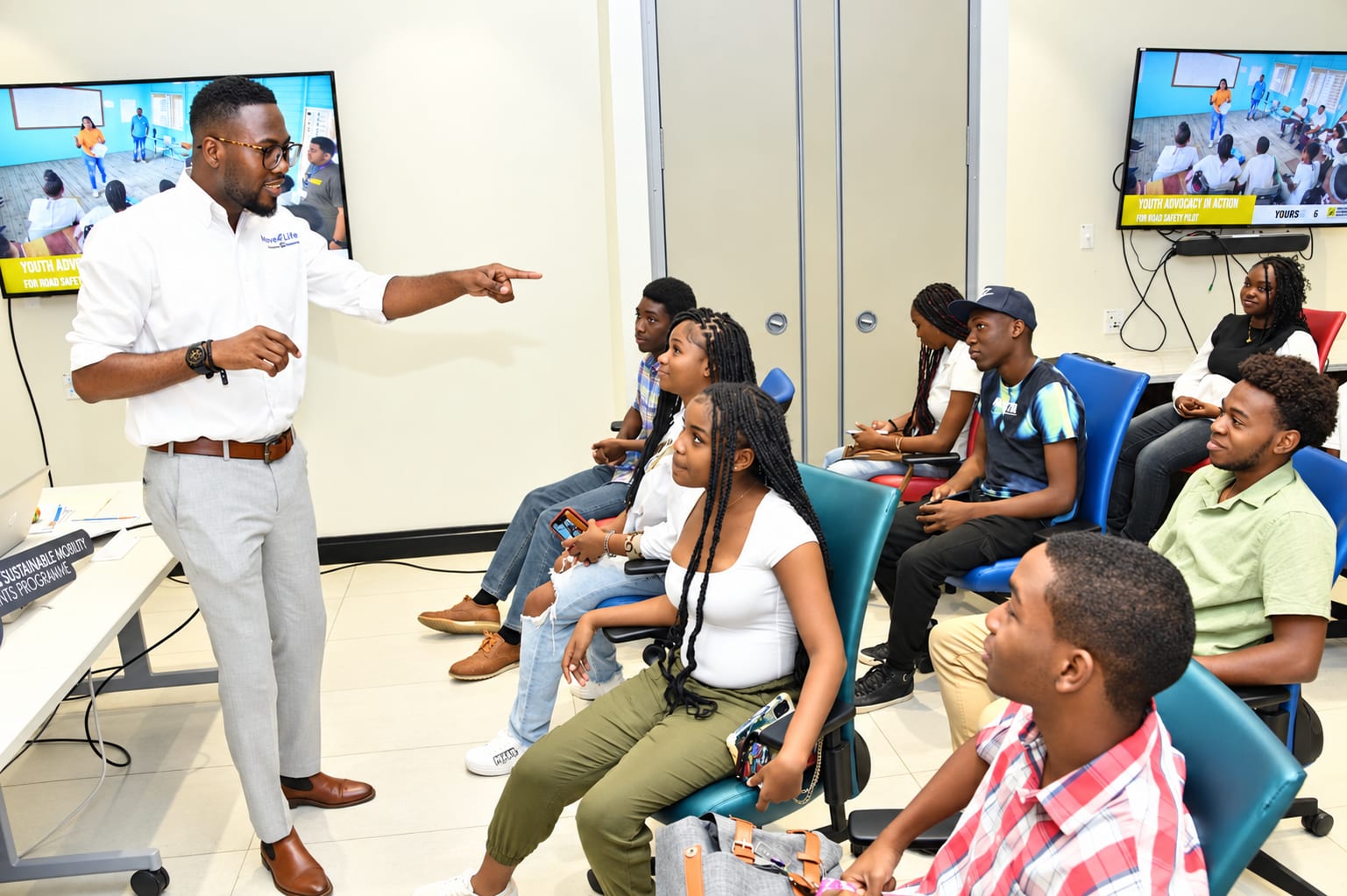 Omar Wright (standing), lead, Environment and Community Development of the JN Foundation and Sydonie Preddie, lead, Youth and Education Programmes at the JN Foundation addressing participants in the workshop.