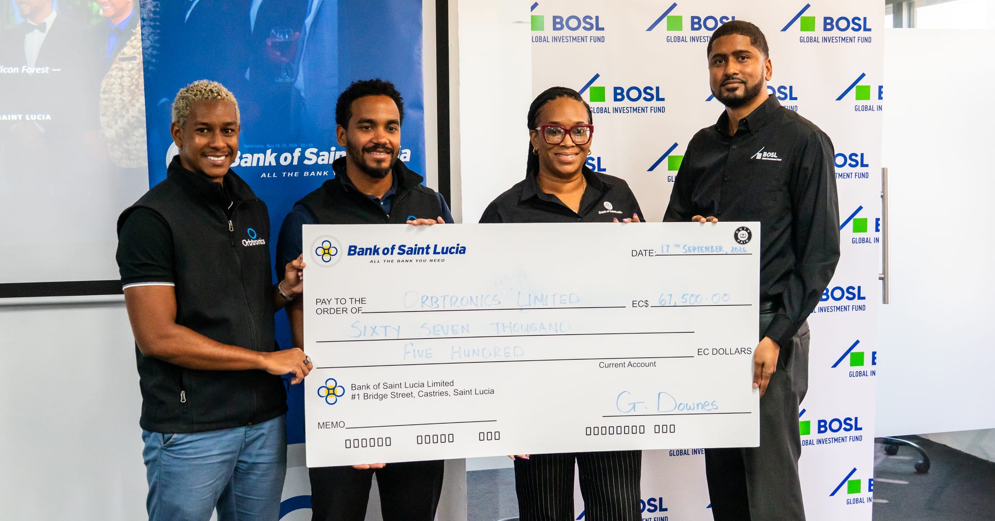 Photo 1 – Orbtronics receiving check from Title Sponsors, Bank of Saint Lucia Limited and BOSL Global Investment Fund